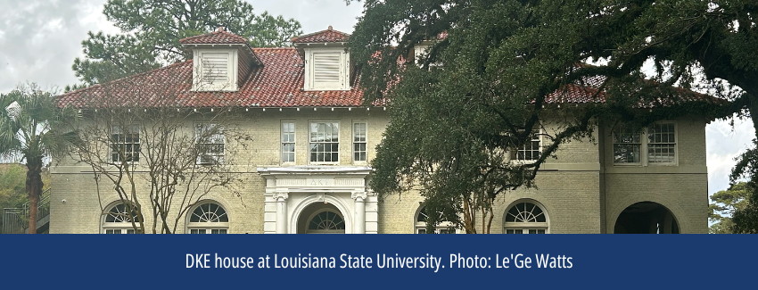 The front of a large home with a gabled roof with the Greek letters DKE over the entry.
