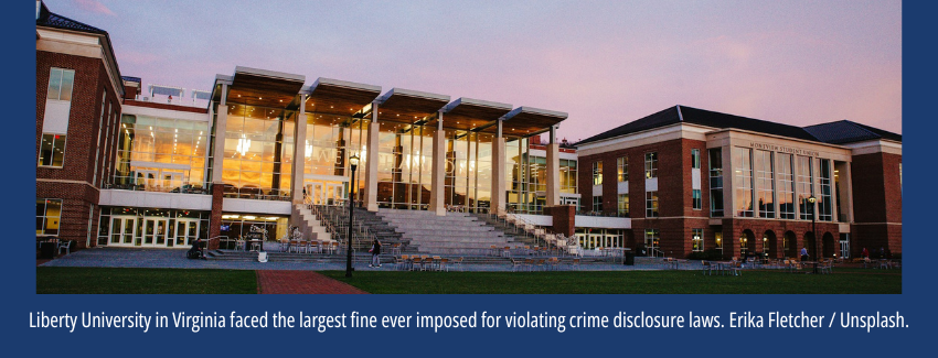 A student union building on a university campus with the sunset reflecting off the windows.