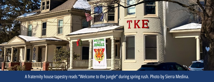 A frat house tapestry reads 